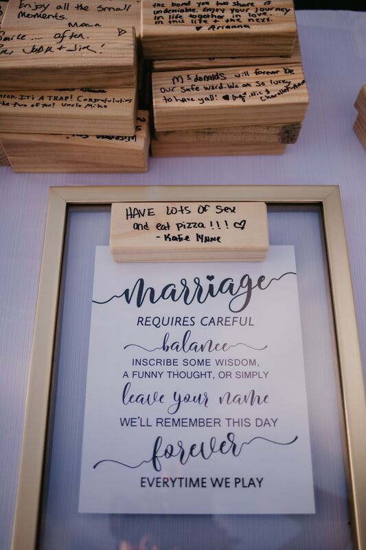 Wooden Jenga pieces as a wedding guest book that guests can write messages on