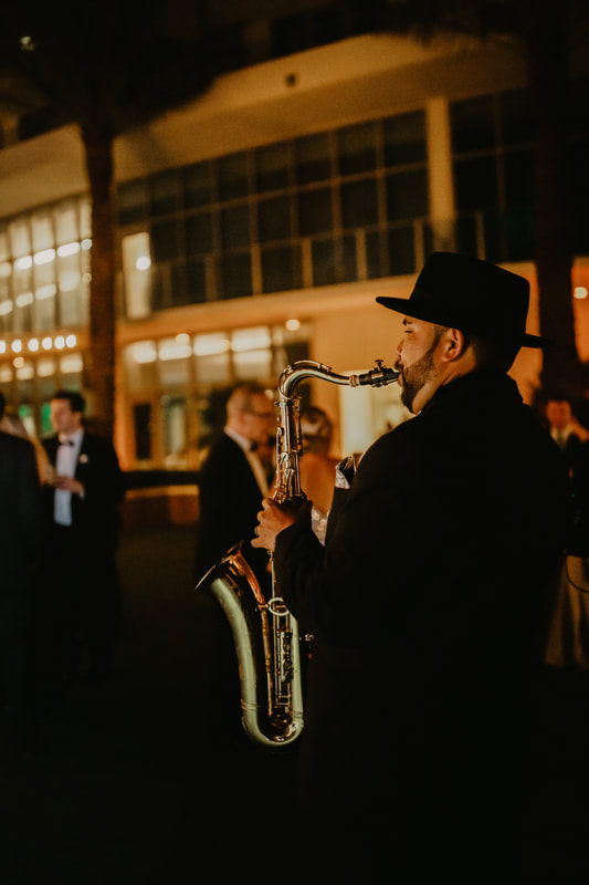 Saxophone player during cocktail hour