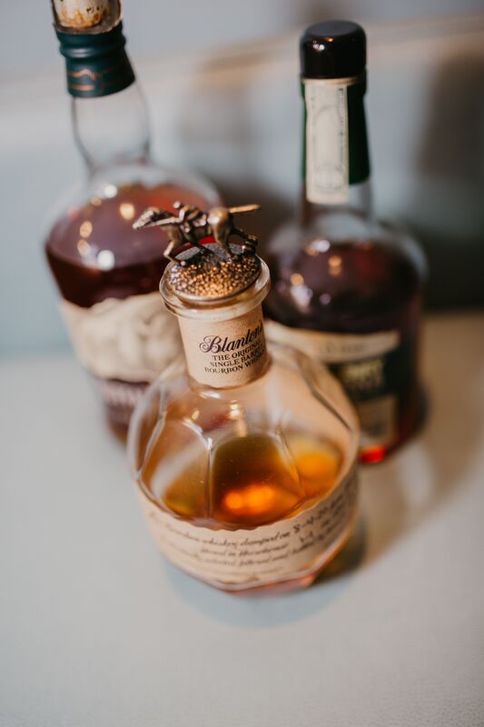Selection of bourbon at a wedding cocktail hour
