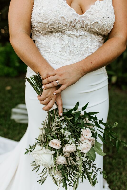 riding holding her bridal bouquet