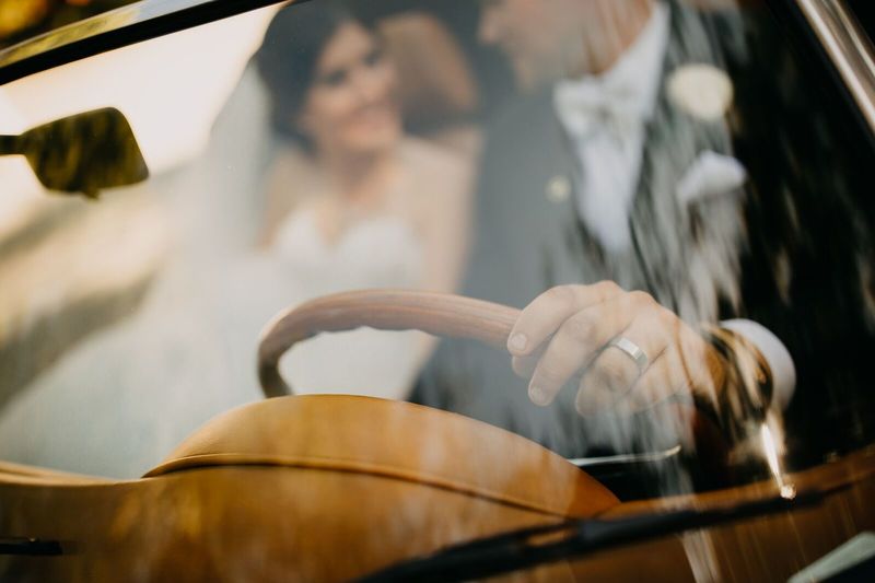 Sarasota Wedding Planner – Sarasota luxury wedding planner – Sarasota wedding – The Ringling - bride and groom with white Porsche convertible - white Porsche convertible