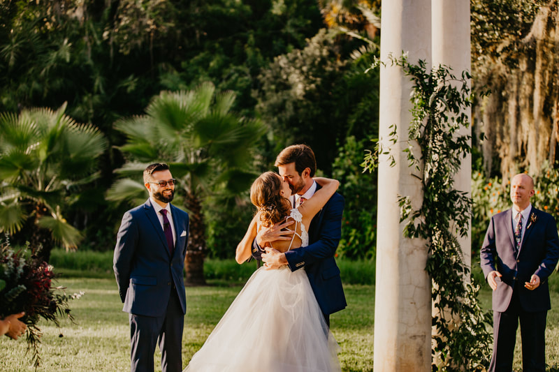 bride and groom kissing at the end of their Selby Gardens wedding
