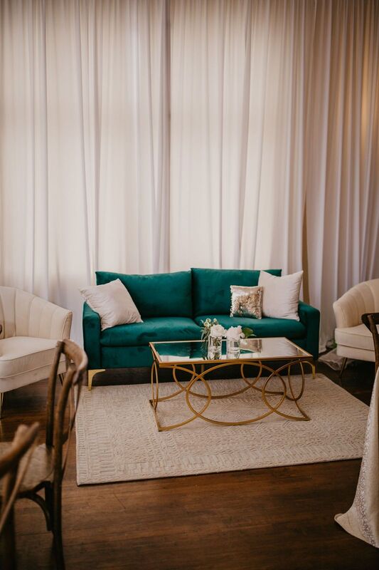Hunter green, white and gold lounge furnishings at The Orlo in Tampa