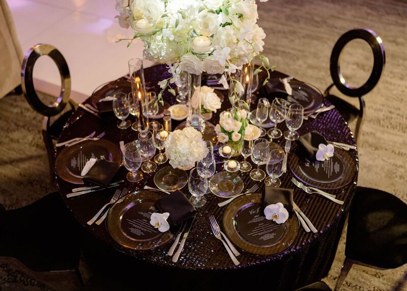 overhead view of an elegant black and white reception table design