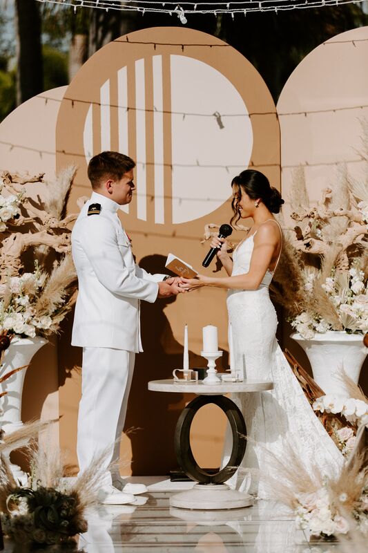 Military groom and his bride exchanging wedding vows