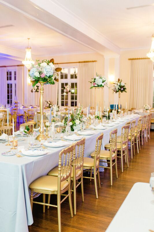 Orlo ballroom set with only tables, gold chivari chairs and elegant centerpieces