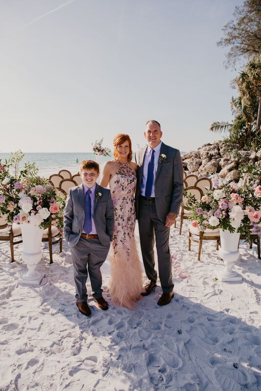 Bride, groom and son on Siesta Key beach