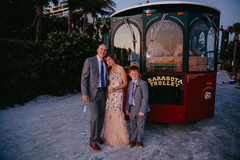 Bride, groom and son on Siesta Key beach