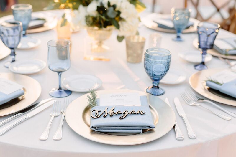 Jennifer Matteo Event Planning – Sarasota Wedding Planner – Sarasota weddings -  Powel Crosley Estate – Powel Crosley weddings - vintage blue glass - gold charger plates - laser cut gold names