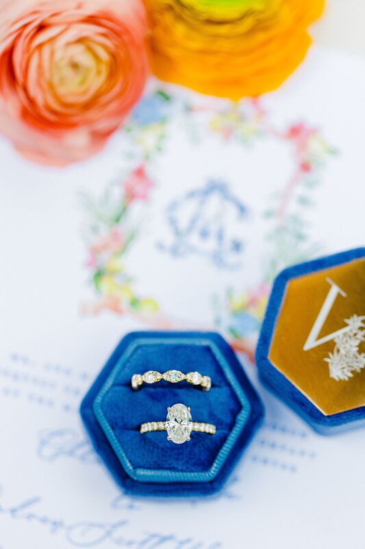 wedding rings set on Beautiful pink, blue and yellow custom wedding invitations for an Amalfi Coast themed wedding