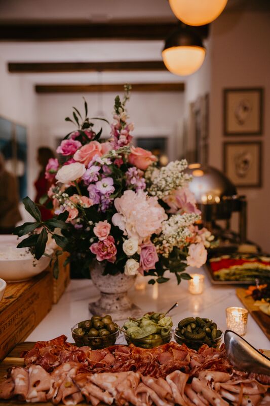 Elegant floral display surrounded by charcuterie display for intimate Sarasota wedding