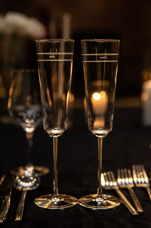 Close-up of Champagne glasses at a luxurious wedding reception in The Mint Ballroom at the Metropolitan at the 9 in Cleveland
