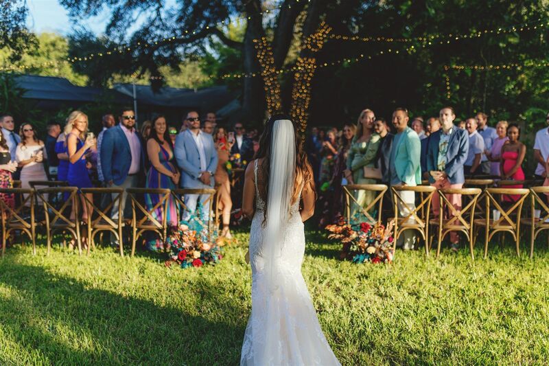 bride walking down the aisle at her outdoor wedding ceremony
