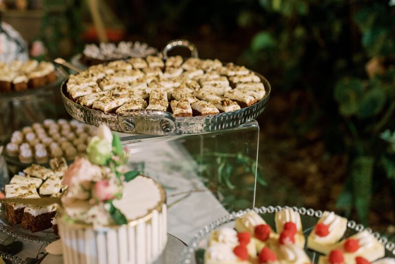 Single tier drip wedding cake and dessert display at a Sunset Beach Resort wedding