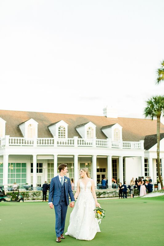 bride and groom on the lawn at Palma Ceia Golf and County Club in Tampa