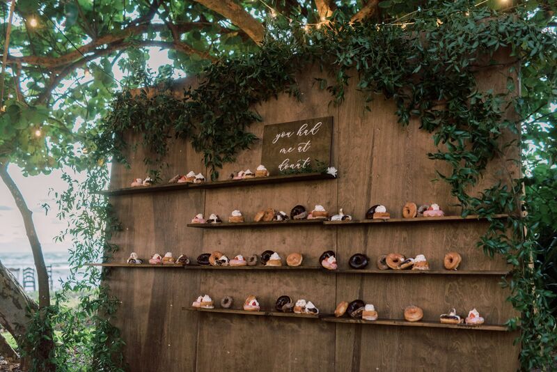 Custom donut wall for rustic wedding reception