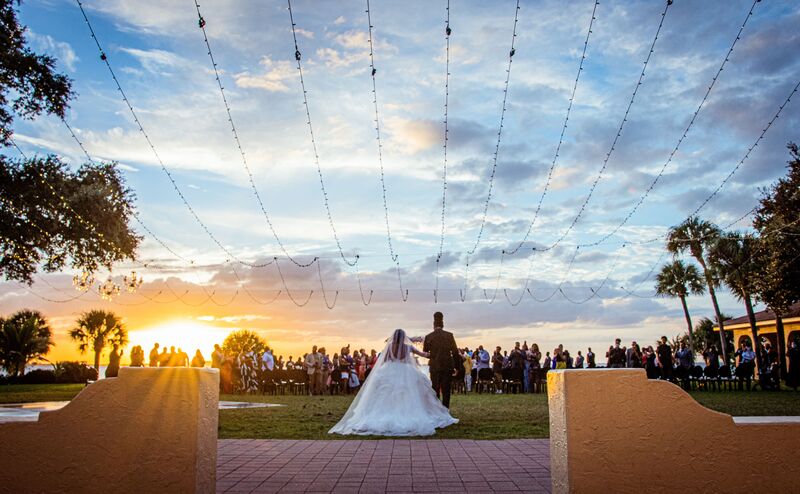 bride walking down the aisle at sunset