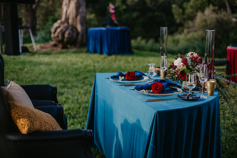 sweetheart tablescape of rich jewel tones at Sarasota wedding reception at Marie Selby Gardens