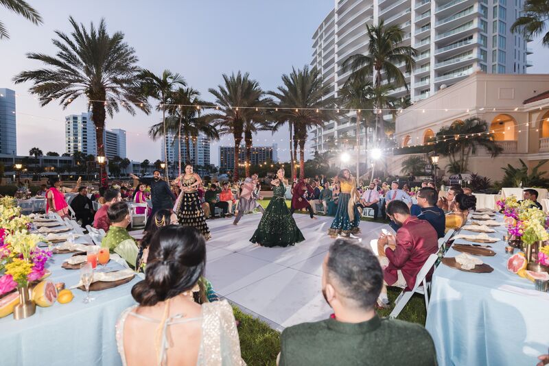 Traditional family dance performances during a Sangeet on the lawn of the Ritz Carlton Sarasota