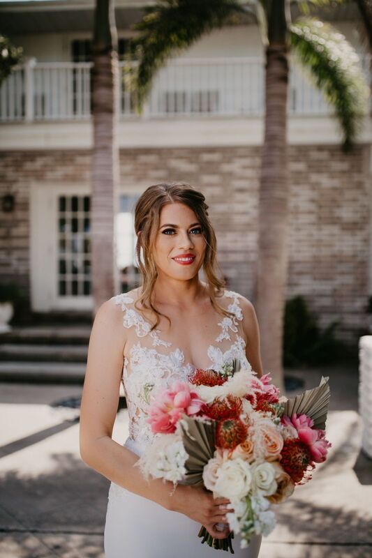 bride with a beach- Boho bridal bouquet in blush, taupe and coral
