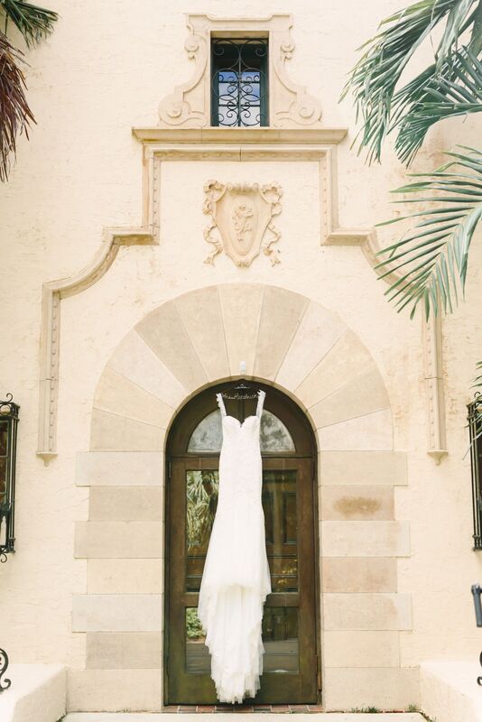 Jennifer Matteo Event Planning – Sarasota Wedding Planner – Sarasota weddings -  Powel Crosley Estate – Powel Crosley weddings - wedding gown - wedding gown hanging on front door