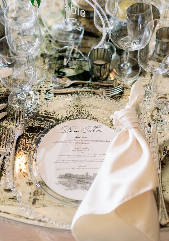 Jennifer Matteo Event Planning – Selby Gardens wedding- Sarasota wedding. Planner- Sarasota luxury wedding planner- Sarasota wedding  - Marie Selby Botanical Gardens - luxurious white and gold wedding reception - clear glass charger plates- custom menu cards - mirrored banquet tables