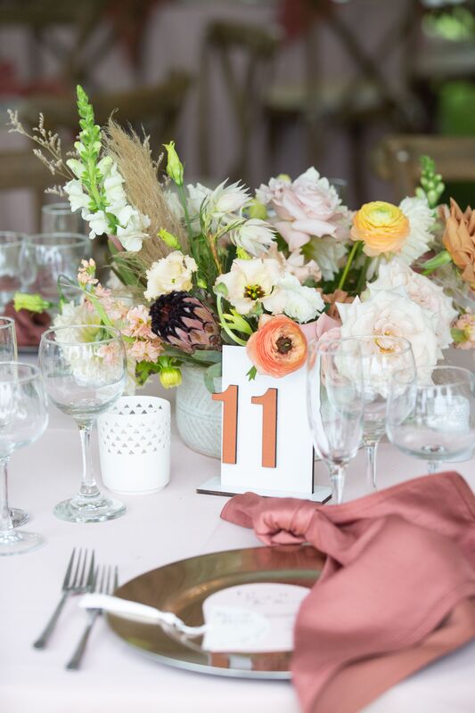 Boho inspired wedding reception decor with modern table number at Casa Ybel