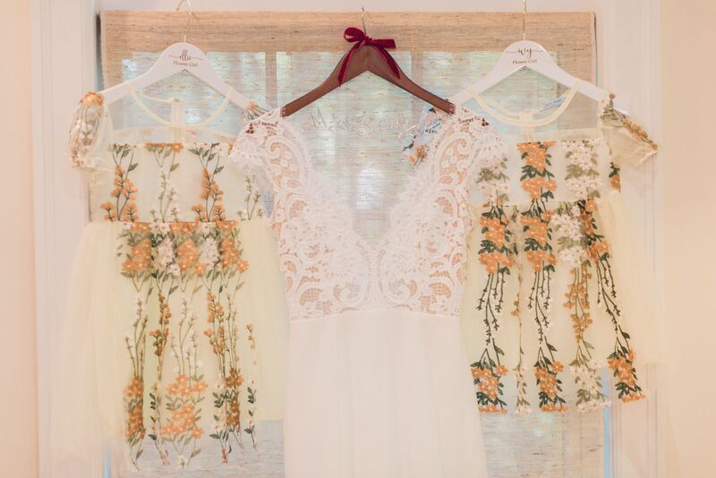 Boho inspired wedding gown with two hand embroidered flower girl dresses