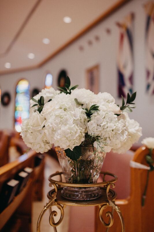 white wedding ceremony flowers at Epiphany Cathedral in Venice Florida