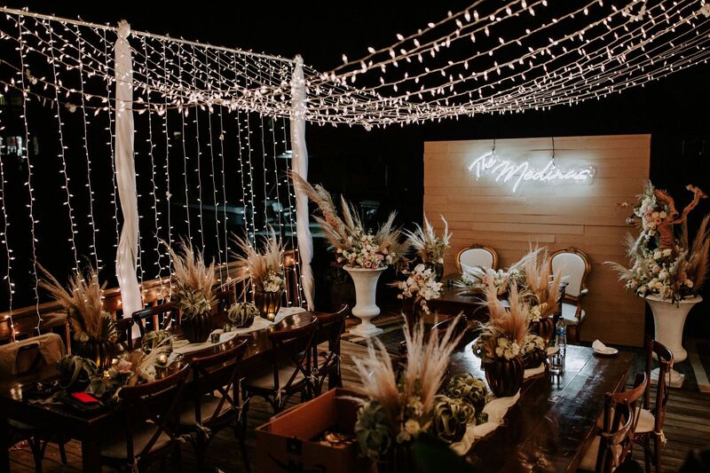 Nighttime view of a Tampa Boho wedding reception decor in soft neutrals