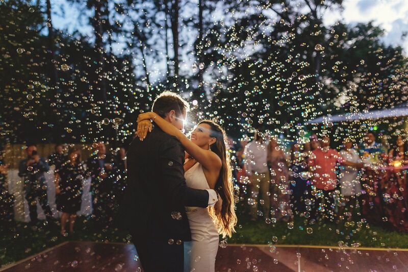 bride and groom';s first dance surrounded by bubbles