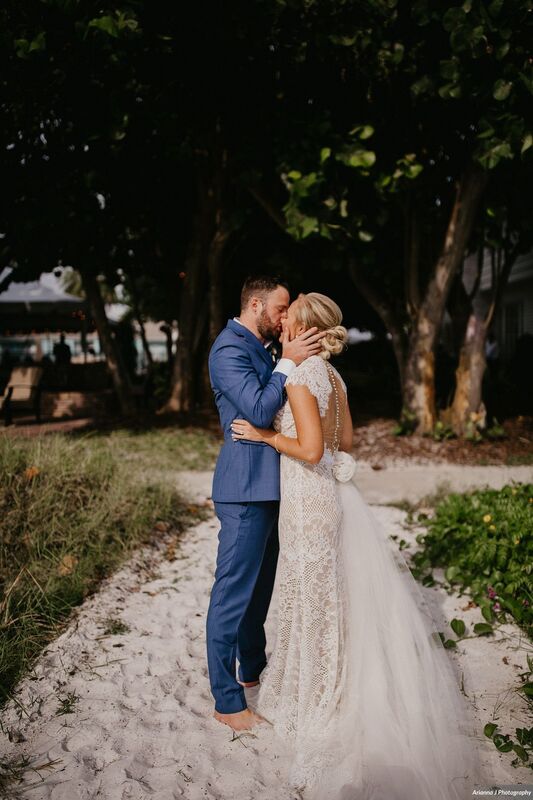 bride and groom kissing after their Siesta Key beach wedding