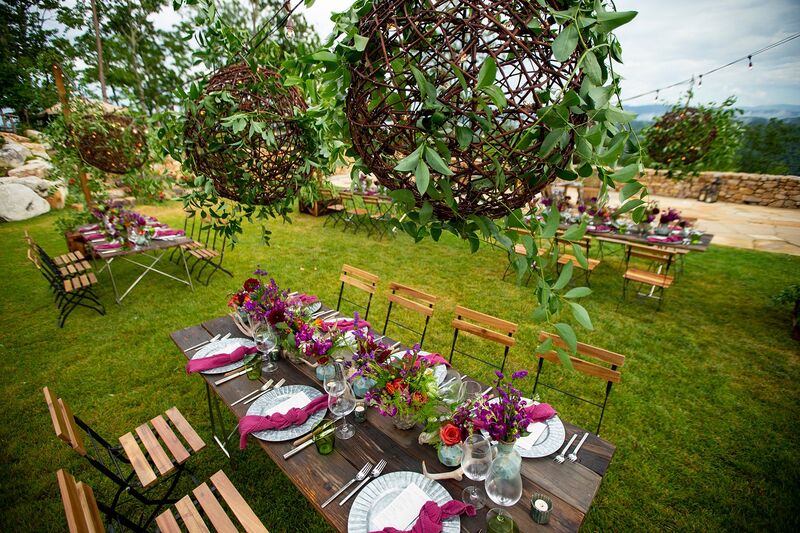 Tables and hanging garden decor for destination wedding weekend welcome reception