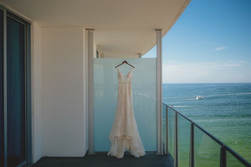 wedding gown on the balcony of the Opal Sands Resort on CLEARWATER BEACH