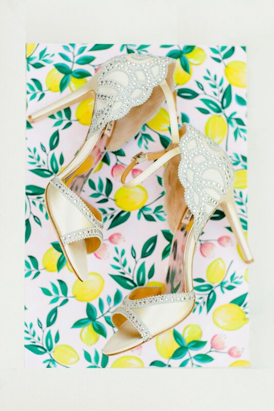 shimmering bridal shoes set against a background of lemon patterned fabric