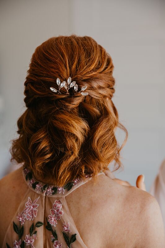 Bride wearing her hair down with an elegant crystal hair comb