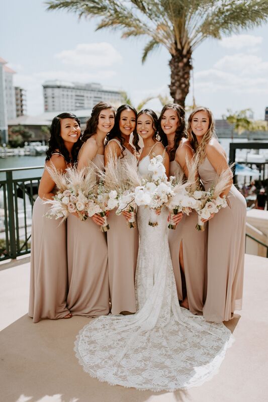 Tampa bride and her wedding party in neutral colored bridesmaids dresses