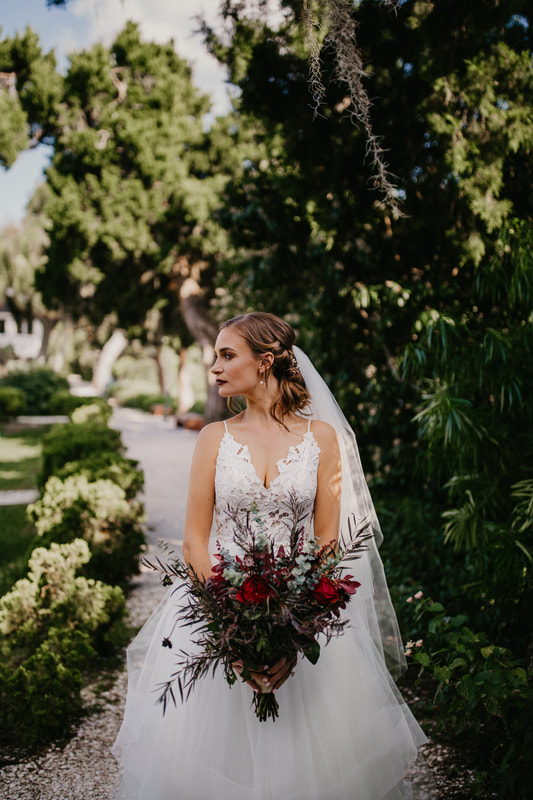 bride holding a lush textured bridal bouquet