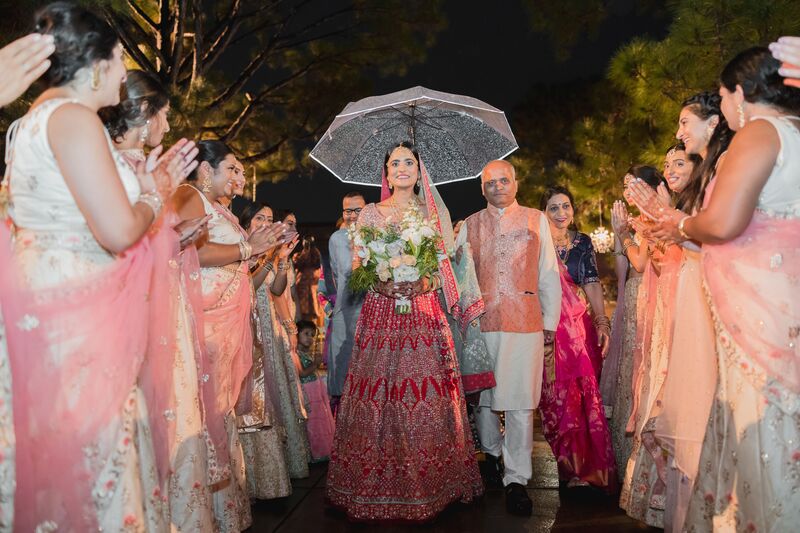 South Asian bride being escorted to the Mandap for her wedding at The Ringling