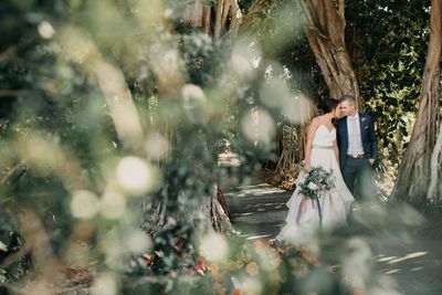 Jennifer Matteo Event Planning – Sarasota Wedding Planner- Selby Garden Wedding -rustic garden wedding - bride and groom at Selby Gardens