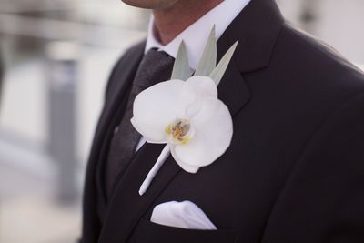 Jennifer Matteo Event Planning  - Sarasota wedding planner- Westin Sarasota – rooftop wedding-white orchid boutonniere 
