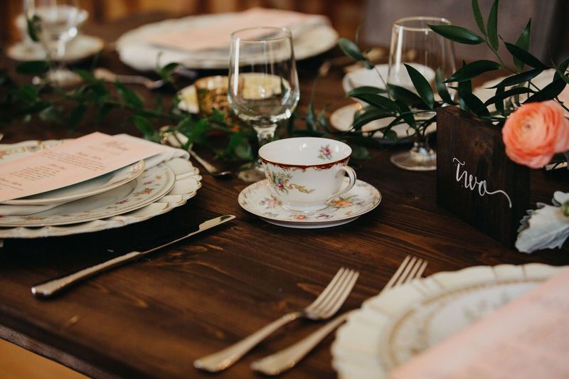 Jennifer Matteo Event Planning – Sarasota wedding planner – Edson Keith Mansion – Sarasota weddings- Edson Keith wedding - wooden reception tables - vintage china for wedding - vintage tea cups