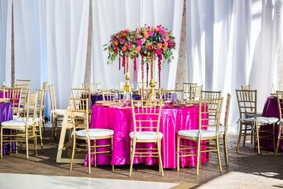 Jennifer Matteo Event Planning – Indian Weddings – Florida Indian wedding planner – Florida Indian weddings - gold chiavari chairs - colorful linen