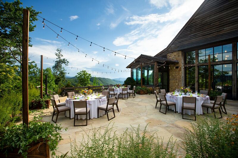 Outdoor wedding reception overlooking the Three Sisters in the Smokey Mountains
